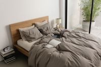 Kaboompics - Unmade Bed with Gray Bedding by a Window