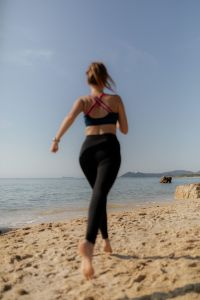 Kaboompics - Woman Running Along the Beach