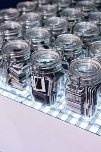 Collection of glass jars with miscellaneous items