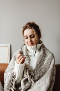 Kaboompics - Cocooning at Home: Woman Resting with Her Glasses in Hand