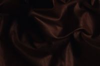 Kaboompics - Dark Brown Satin Textile With Shadowed Draped Folds