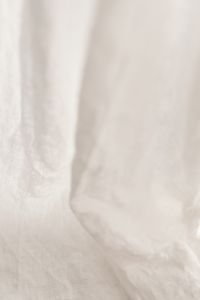 Kaboompics - White Linen Fabric Background with Soft Wrinkles and Fine Woven Grain