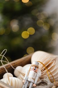 Kaboompics - Neutral Christmas Ornaments in a Box with Bokeh