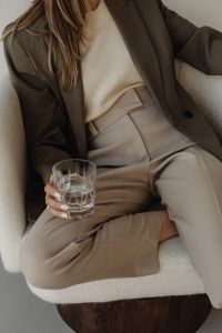 Kaboompics - Neutral Lifestyle Fashion with Woman Holding a Glass