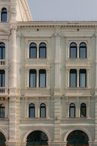 Kaboompics - White Neoclassical Building Facade with Arched Windows in Trieste