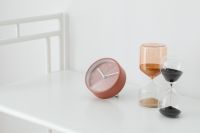 Kaboompics - Rose-Pink Table Clock and Two Glass Hourglasses in a Bright Minimalist Desk Still Life