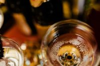Kaboompics - Champagne Flutes with Rising Bubbles and Golden New Year's Eve Party Bokeh