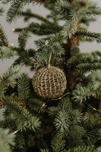 Kaboompics - Close-Up Gold Woven Ornament on a Christmas Tree