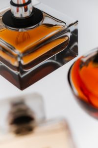 Kaboompics - Amber Perfume Bottle Still Life Close Up