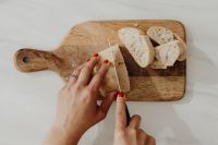 Kaboompics - Overhead View of Cutting Bread into Slices