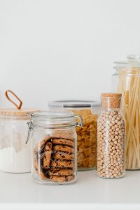 Kaboompics - White Kitchen Copy Space with Minimal Glass Jars of Pasta and Pantry Staples