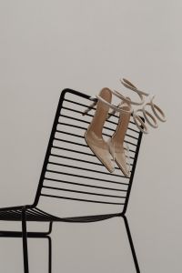 Kaboompics - Mixed High Heels Styled on a Sofa with Neutral Pillows