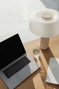 Kaboompics - Neutral Workspace Close-Up with Travertine Lamp and Laptop