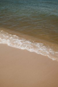 Kaboompics - Small Waves Reaching a Sandy Shore