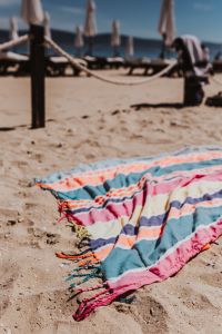 Kaboompics - Colorful beach towel on the sand