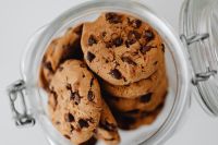 Kaboompics - Top View of Homemade Chocolate Chip Cookies Stored in an Open Glass Jar