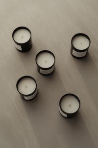 Kaboompics - Flat Lay of Scented Candles on a Light Surface