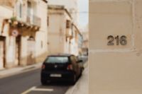 Kaboompics - House Number 216 on a Weathered Facade