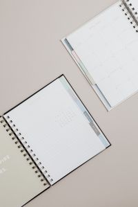 Kaboompics - Open Planners with Calendar and Notes Pages on Beige Background