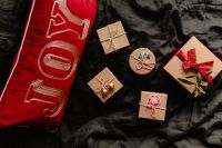 Kaboompics - Red Ribbon Gift Box in a Cozy Bedroom