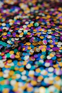 Kaboompics - Gold, Blue and Purple Sequins with Focused Foreground, Vertical Fabric Background