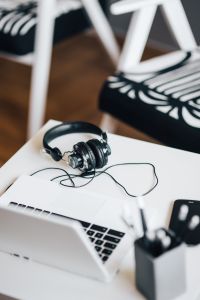 Kaboompics - White laptop with smartphone and headphones