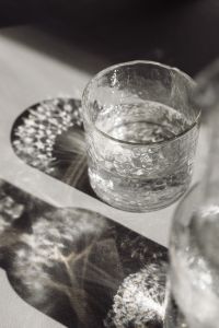 Kaboompics - Water Glass With Layered Chair and Jug Shadows