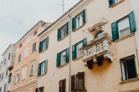 Kaboompics - Historic Pastel Facade with Green Shutters and Ornate Balcony, Rovinj