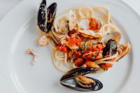 Kaboompics - Overhead Seafood Pasta with Shrimp, Mussels and Tomato Sauce