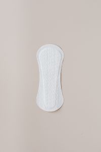 Kaboompics - Single Sanitary Pad Isolated on Beige with Generous Copy Space