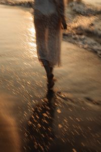Kaboompics - Motion Blur Woman Walking on Beach at Sunset