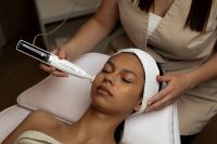 Kaboompics - Professional Facial Treatment with Handheld Device