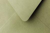 Kaboompics - Olive Green Speckled Paper Envelope Close-Up with Curved Flap and Copy Space, Minimal Stationery Mockup Background for Branding