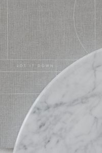 Kaboompics - Minimal Gray Fabric Journal and Marble Still Life for Calm Branding and Stationery