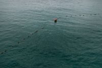 Kaboompics - Floating Safety Buoys on Blue-Green Seawater