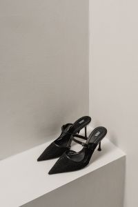 Kaboompics - Pair of Black Woven Slingback Heels on White Ledge