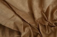 Kaboompics - Macro View of Soft Brown Curtain Fabric with Overlapping Folds