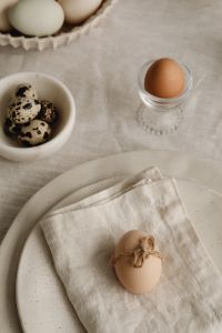 Kaboompics - Easter Egg Wrapped In Twine On Linen Napkin