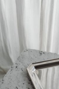 Kaboompics - Reflective Silver Tray on Speckled Gray Stone Surface