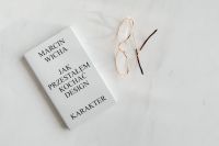 Kaboompics - Gold Eyeglasses And White Design Book On Marble