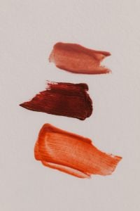 Kaboompics - Coral Red and Orange Lipstick Swatches
