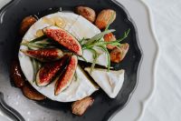 Kaboompics - Camembert Cheese Board with Fig Wedges, Almonds and Rosemary