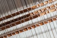 Kaboompics - Woven White Textile on a Wooden Loom
