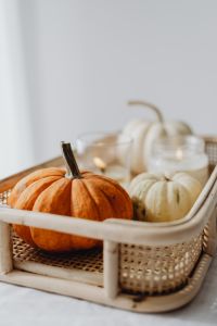 Kaboompics - Soft-Focus White Pumpkin in a Wicker Tray on White Linen, Autumn Still Life