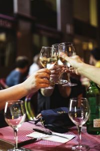 Friends at a restaurant drinking wine