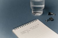 Kaboompics - Notebook And Glass On Minimal Office Desk Aesthetic