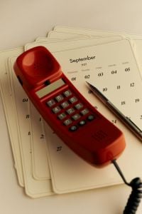Kaboompics - September 2027 Calendar With Red Corded Telephone and Pen