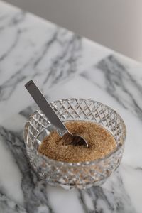 Kaboompics - Brown Sugar in Cut-Glass Bowl on Arabescato Marble