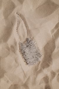 Kaboompics - Silver Beaded Mini Bag on Rippling Sand