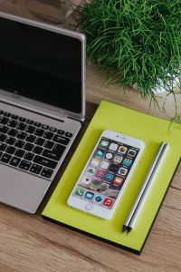 Kaboompics - White Apple iPhone, Silver Acer Laptop And Pencils On Yellow Notebook